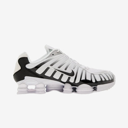 Nike Shox TL White/Black-Metallic Platinum athletic shoes with breathable mesh and TPU overlays for support.