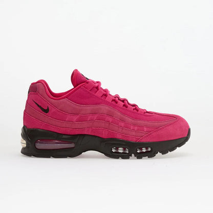Nike Air Max 95 in Fireberry colorway featuring suede upper with black accents and visible Air cushioning.